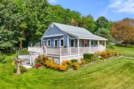 Surrounded by colorful gardens and green countryside, this charming retreat feels right at home in Wine Country.